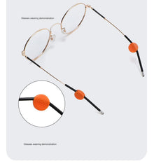 Compact anti-slip eyeglass retainers shown on compatible frame temples