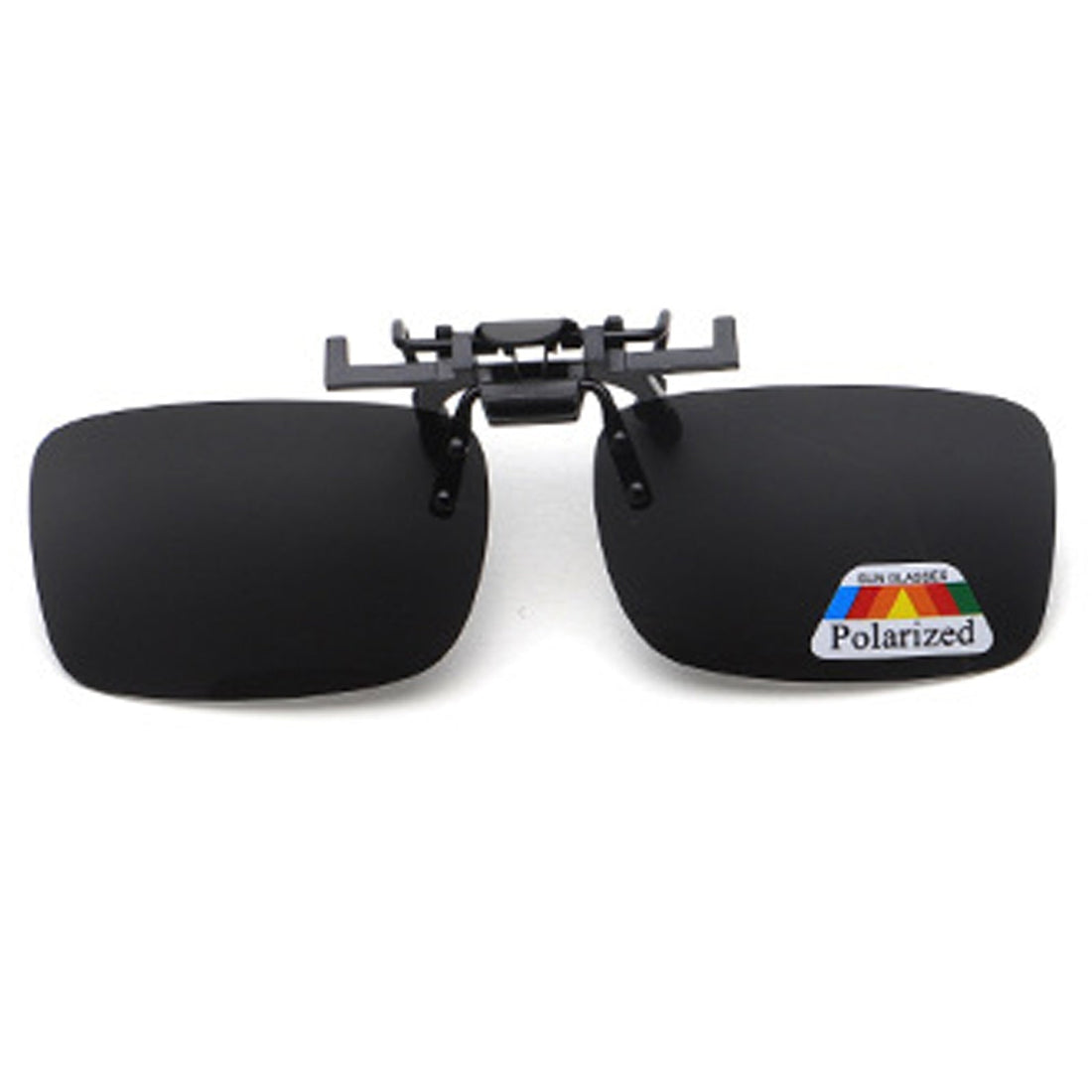 Polarized clip-on sunglasses positioned over prescription glasses