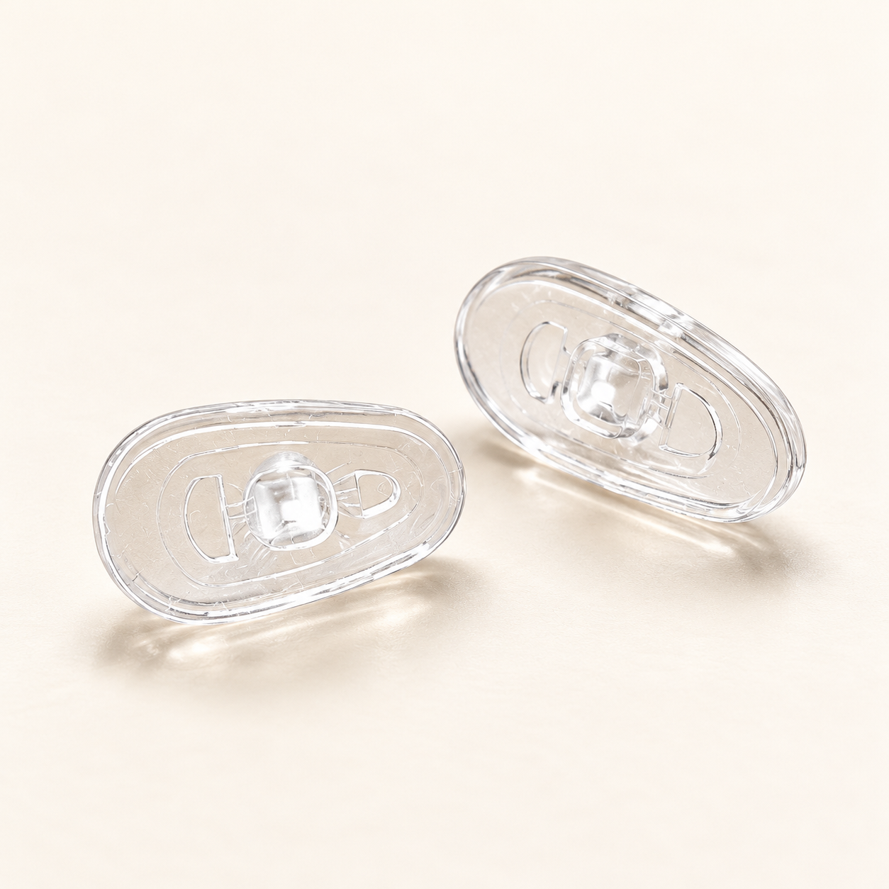 One pair of clear G13 13mm screw-in silicone nose pads