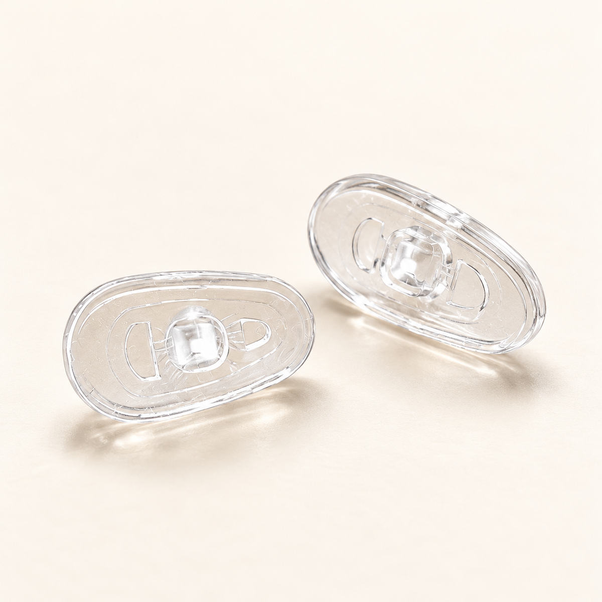 One pair of clear G13 13mm screw-in silicone nose pads